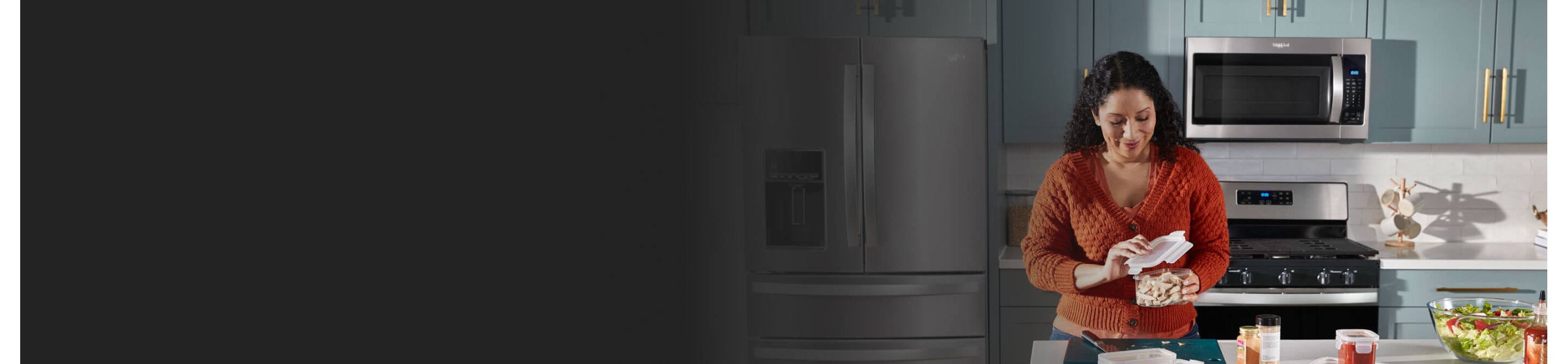 Woman opening a container in her kitchen