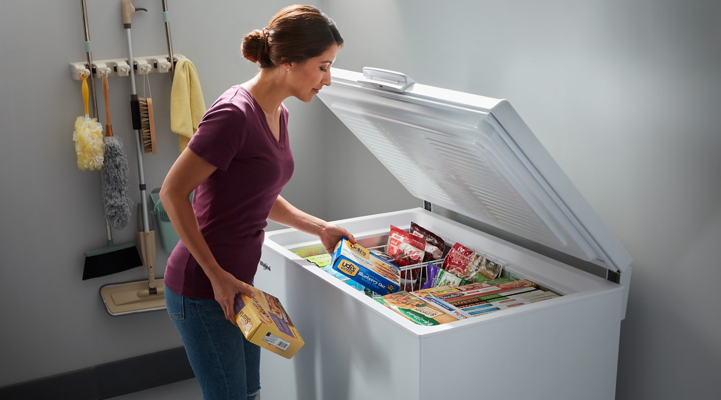 Person Using Chest Freezer How Does a Freezer Work? | Whirlpool