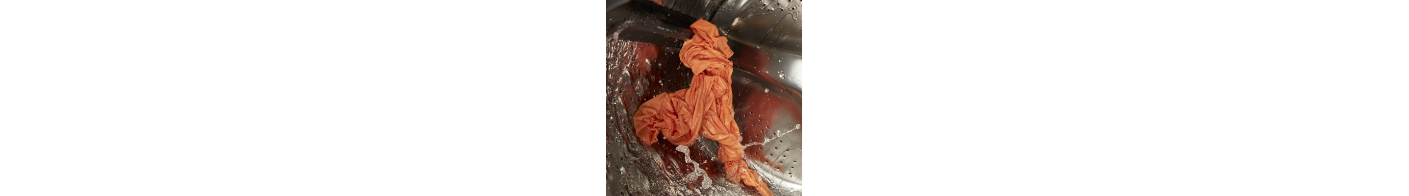Clothes going through a drain and spin cycle