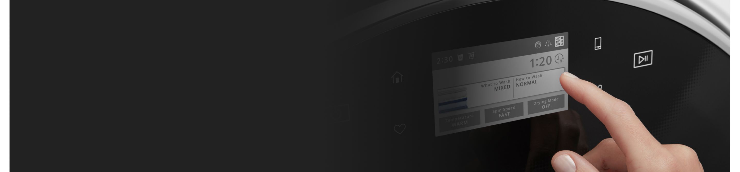 Person selecting a setting on a washing machine control panel