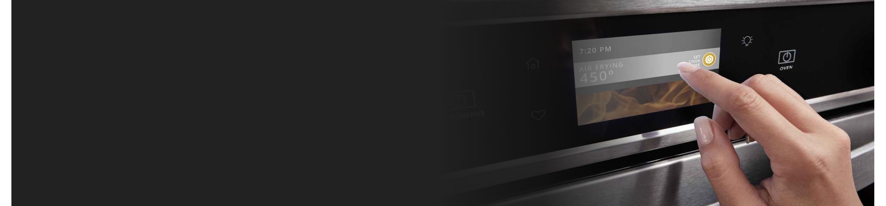 A closeup of a person programming a Whirlpool® oven with Air Fry Mode.