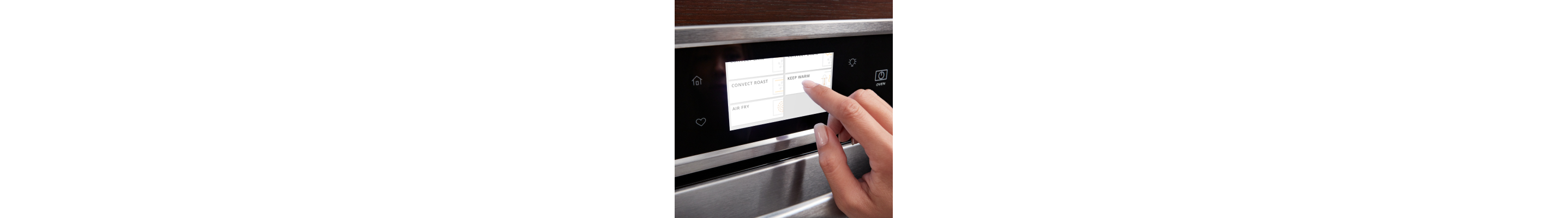 A finger pressing a digital control
