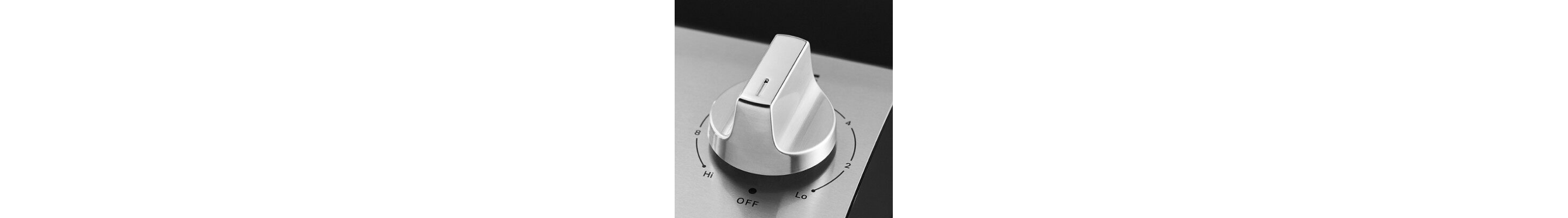 Close-up of stainless steel electric stovetop knob