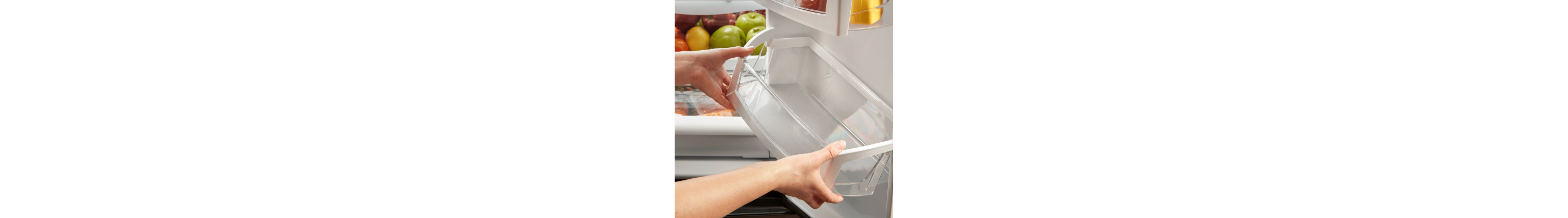 Pair of hands removing a refrigerator shelf