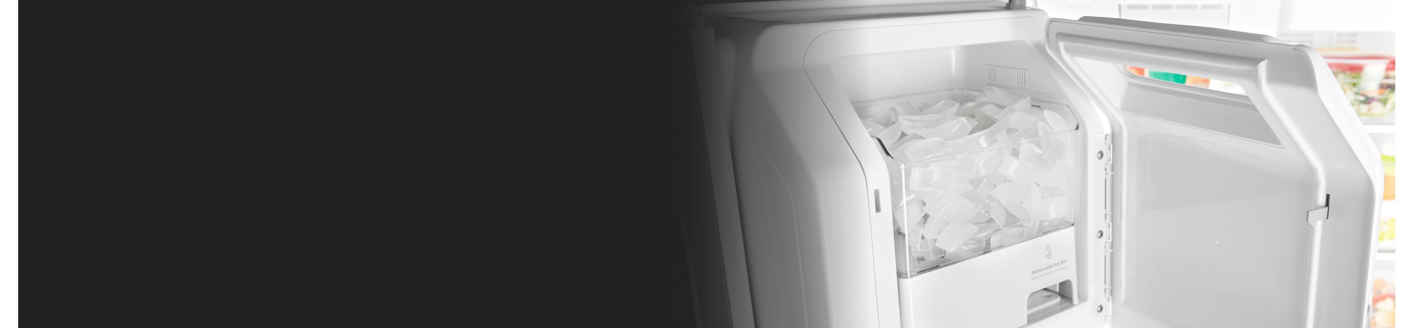 Inside of an ice maker filled with ice