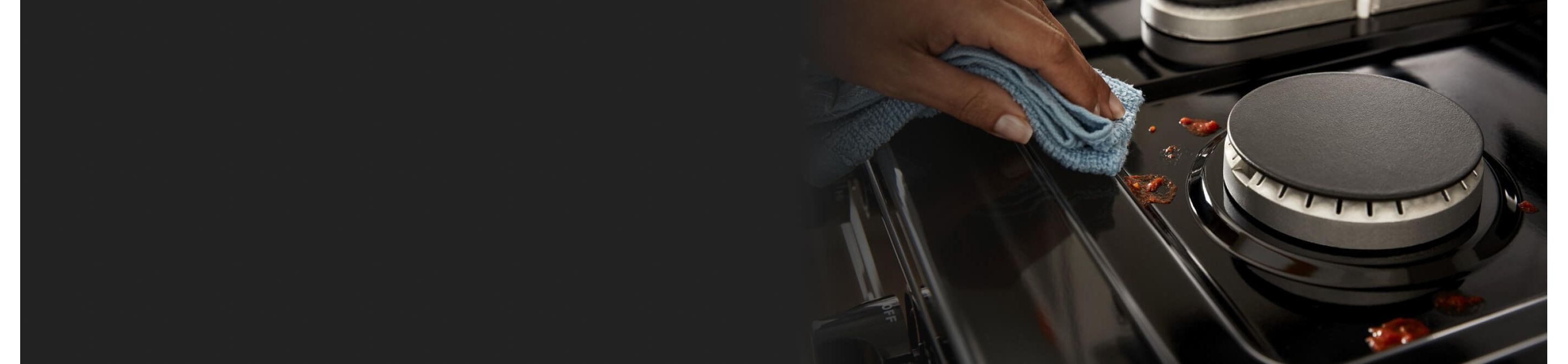 Person wiping a stovetop