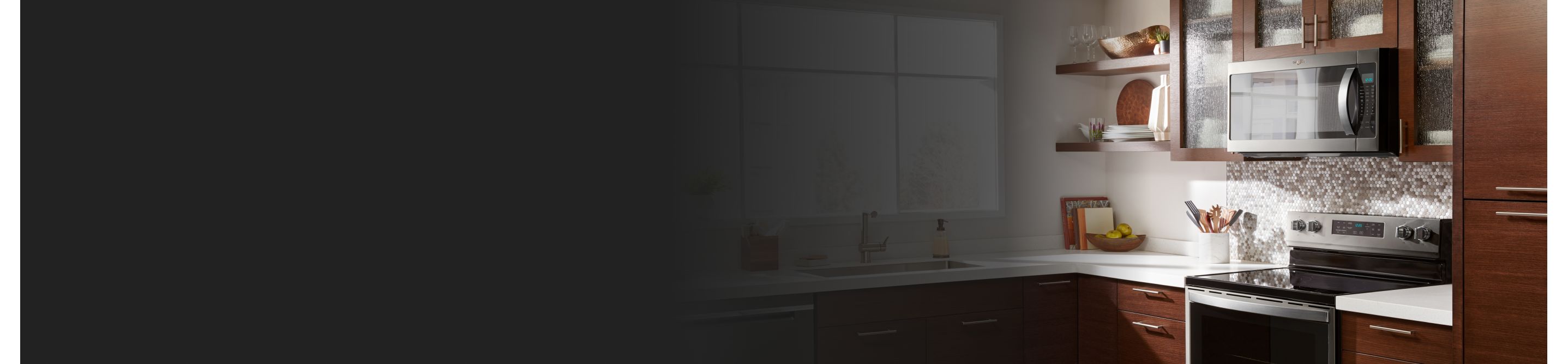 Wood cabinets and kitchen counter with microwave and oven