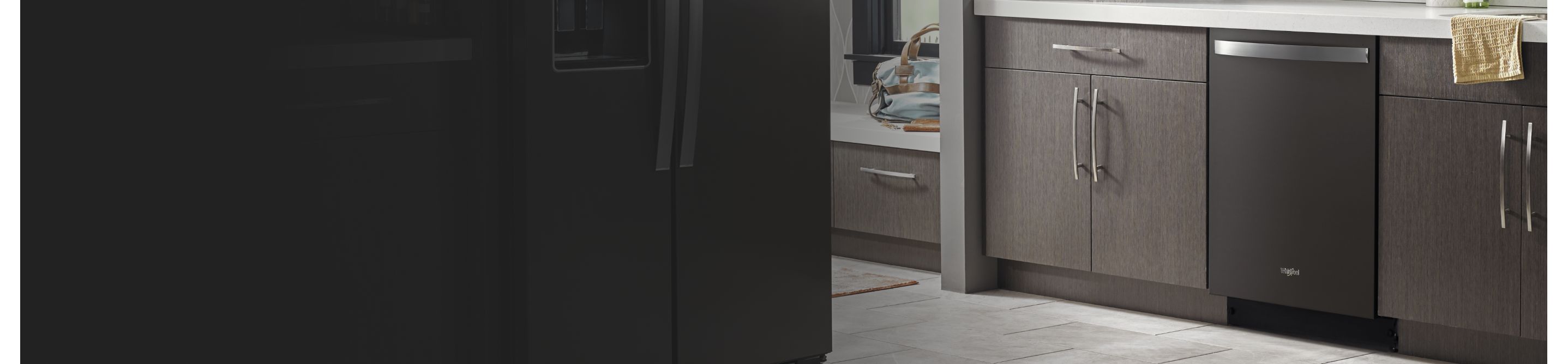Gray kitchen cabinets outside of a laundry room