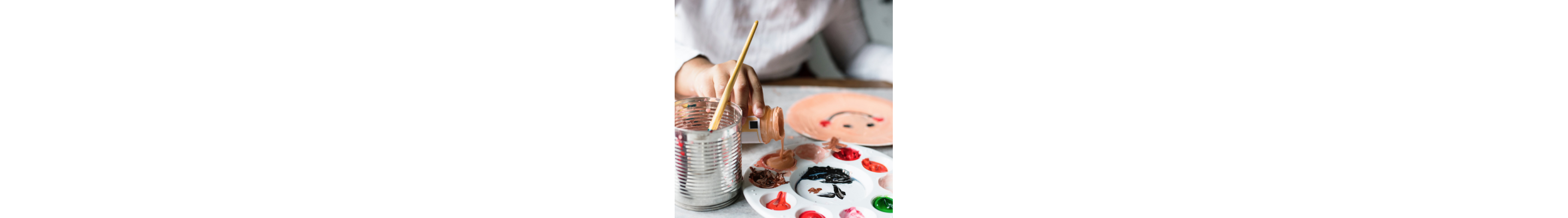 A child painting with acrylics