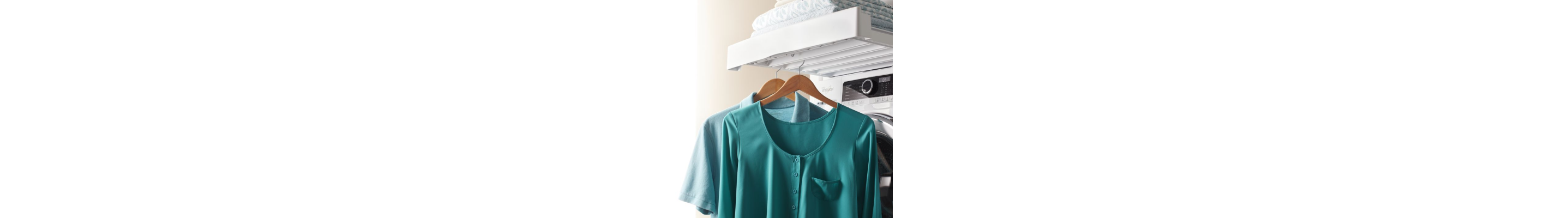 Two blue shirts hanging from hangers