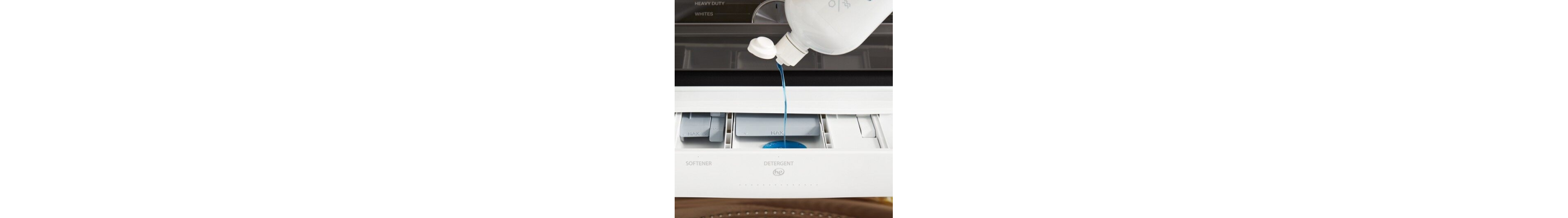 Detergent being added to detergent dispenser
