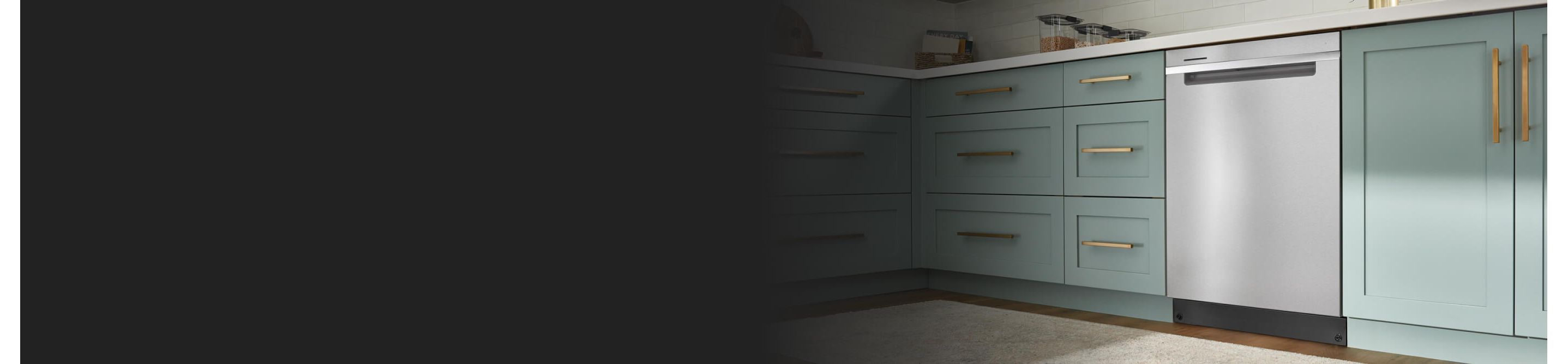 A Whirlpool® Dishwasher surrounded by teal cabinetry