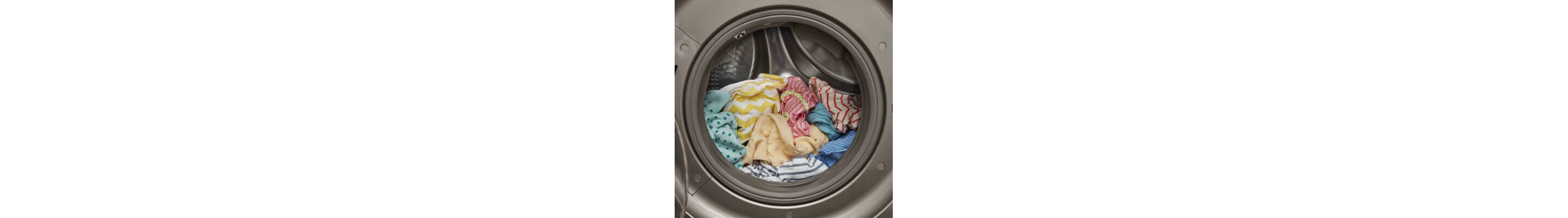 Front load washer opened with colorful clothes inside