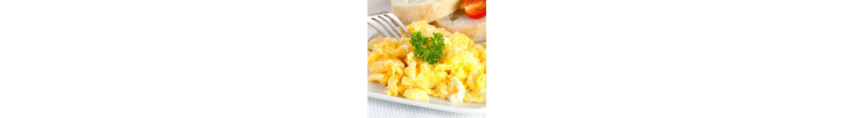 Scrambled eggs with parsley garnish
