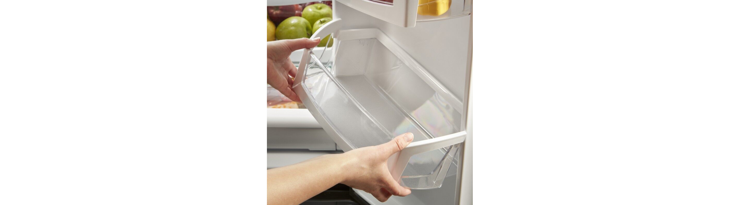 Person removing a shelf from the fridge