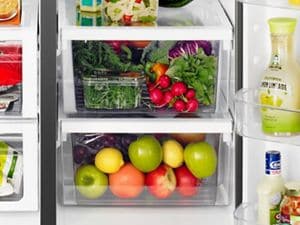 Full size side by outlet side refrigerator freezer