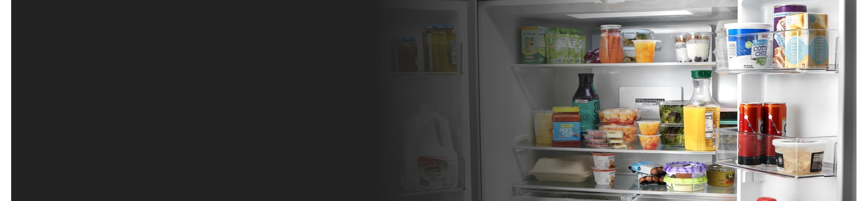 An open, stocked Whirlpool® Refrigerator