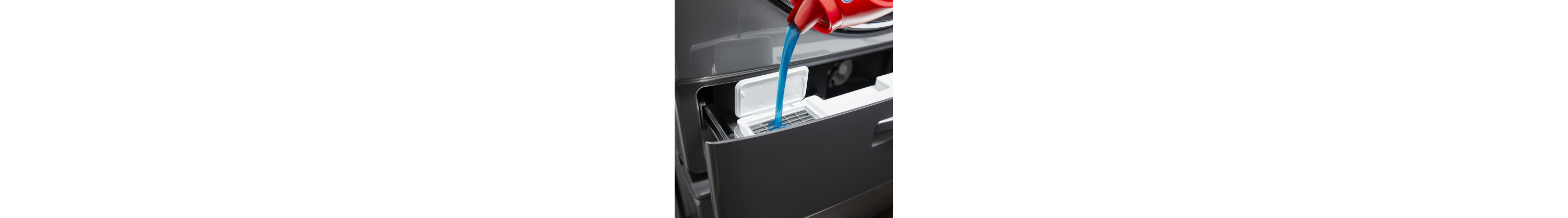 Detergent being poured into a dispenser