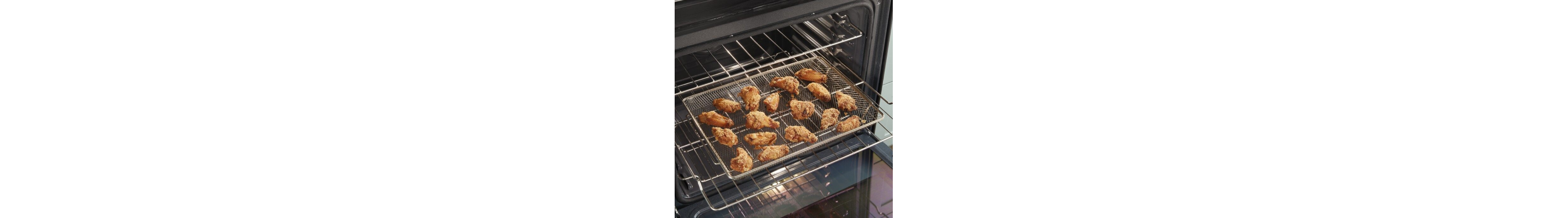 Food cooking in an air fryer basket