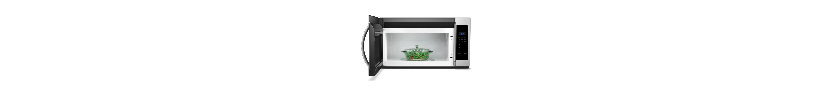 Open microwave door showing pot of green beans in a glass dish