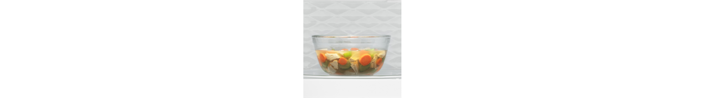 Sliced vegetables inside a glass bowl