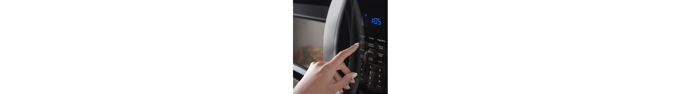 Person selecting a cooking preset on a Whirlpool® microwave