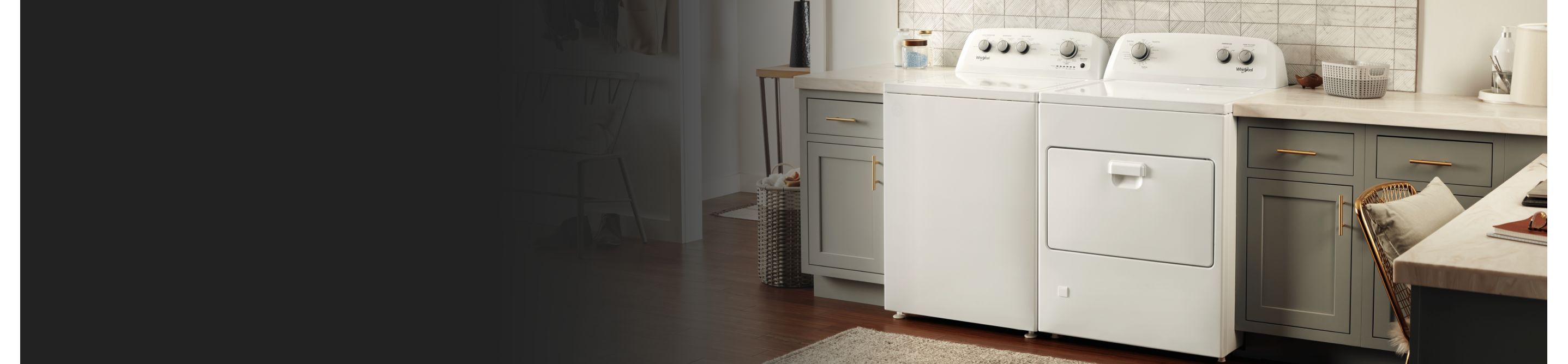 A white Whirlpool® washer and dryer pair in a laundry room