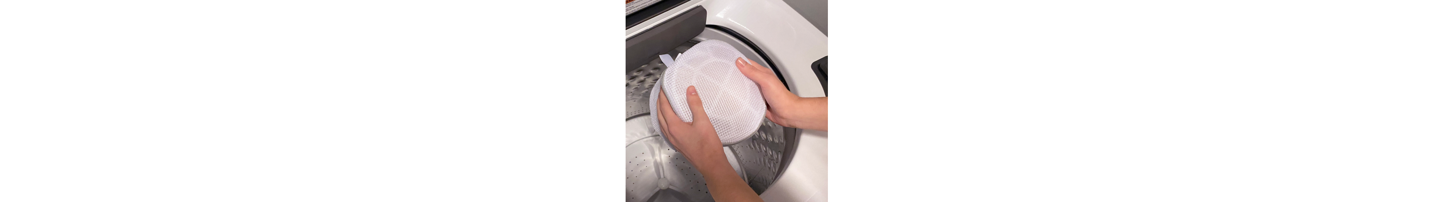 Mesh lingerie bag being placed inside a Whirlpool® washing machine
