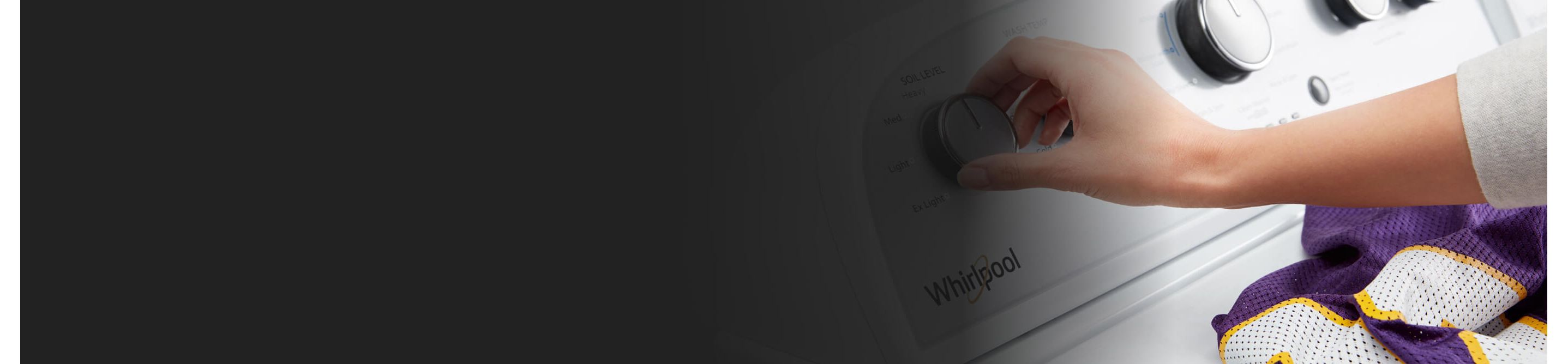 A person adjusting Whirlpool washer’s settings