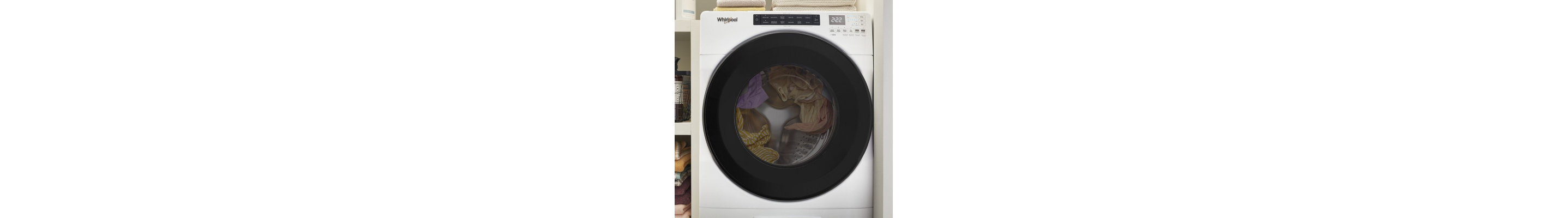 A running washer filled with clothes