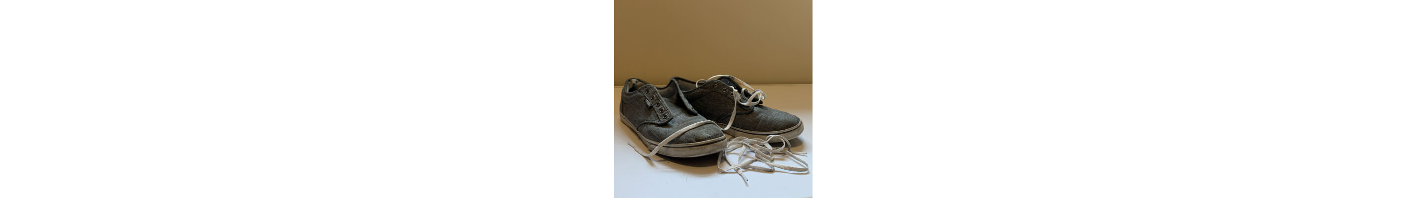 Dirty shoes with shoe laces removed