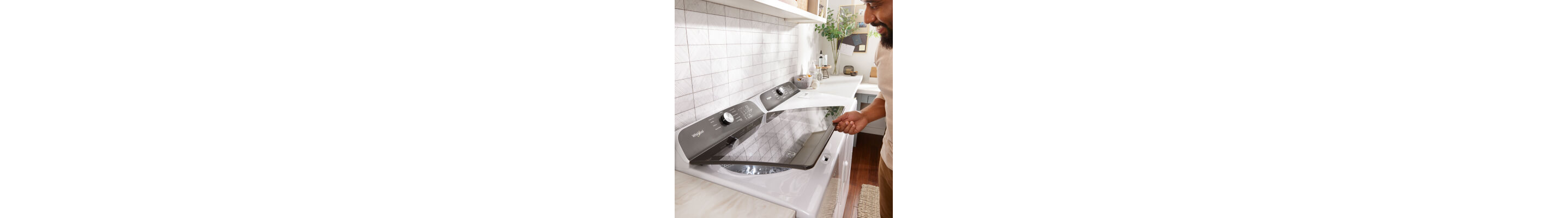 Person looking through the transparent lid of a Whirlpool® Washer
