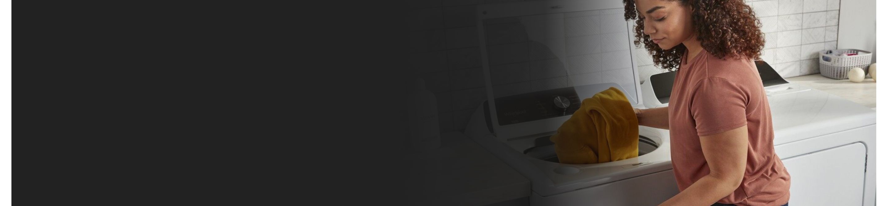  Person placing clothing in a washing machine