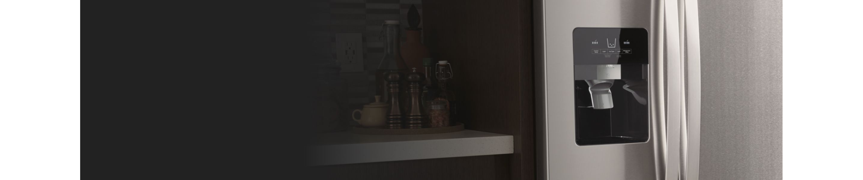 Close up of silver refrigerator ice maker chute