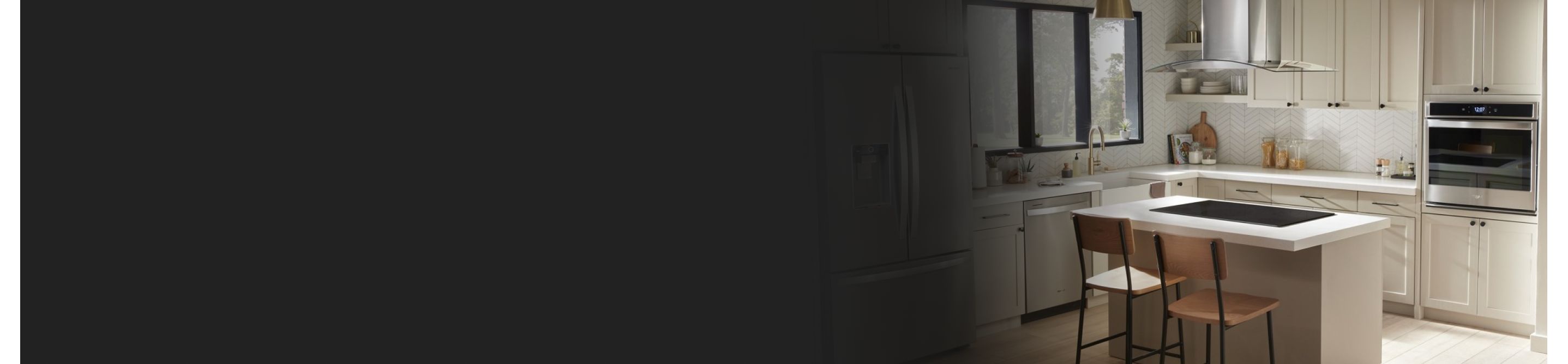 Off white kitchen with cooktop in island