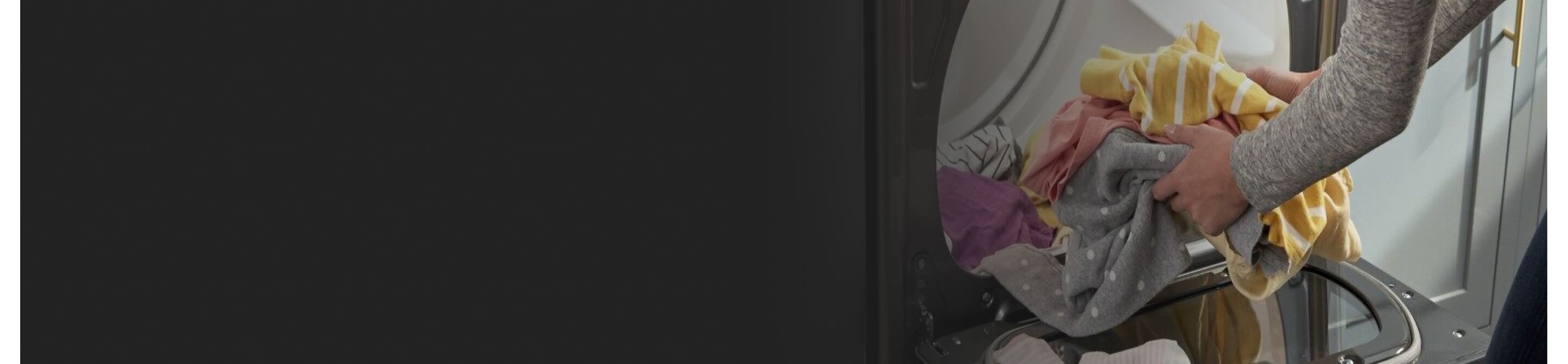 Person removing clothes from the dryer