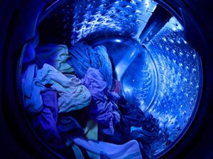 The blue glow of UV light inside a Whirlpool® Washer with UV Clean Technology