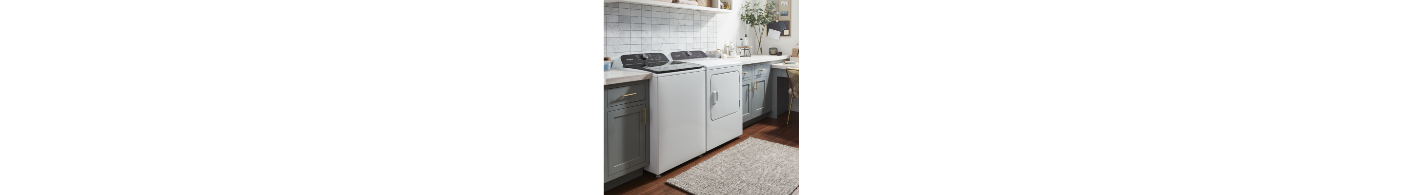 A laundry room featuring a Whirlpool® washer and dryer