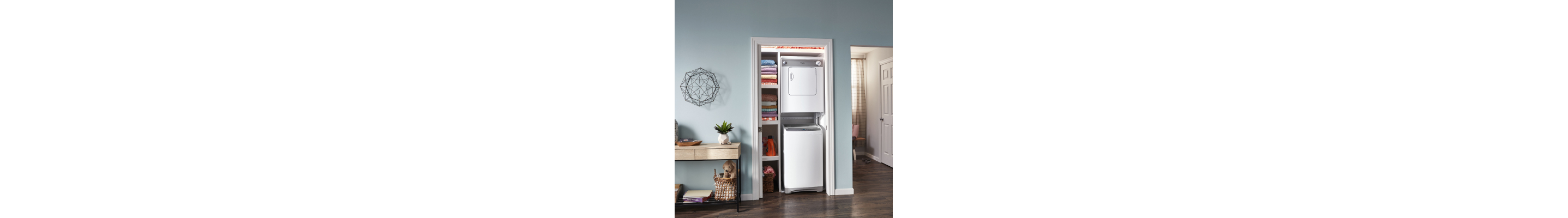 Laundry appliances stacked in shallow shelving