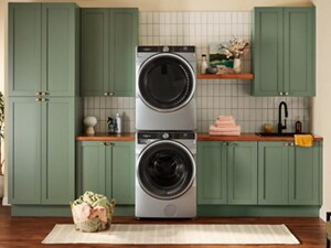 A stacked Whirlpool® Washer and Dryer in a laundry room