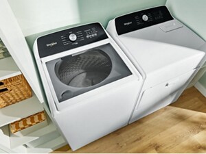 A white Whirlpool® Top Load Washer and Dryer set