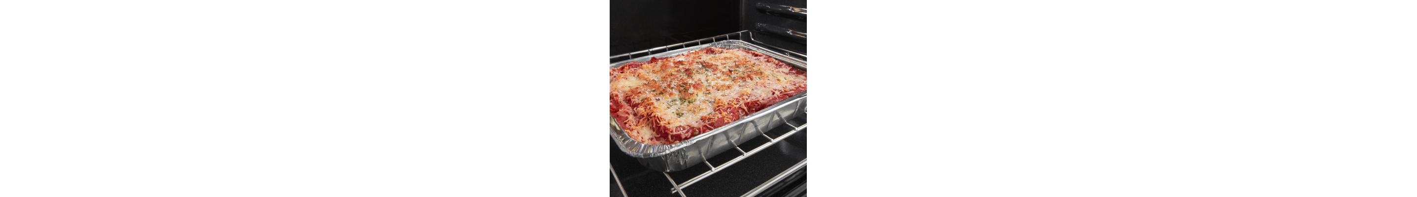 Cheesy pasta baking in oven