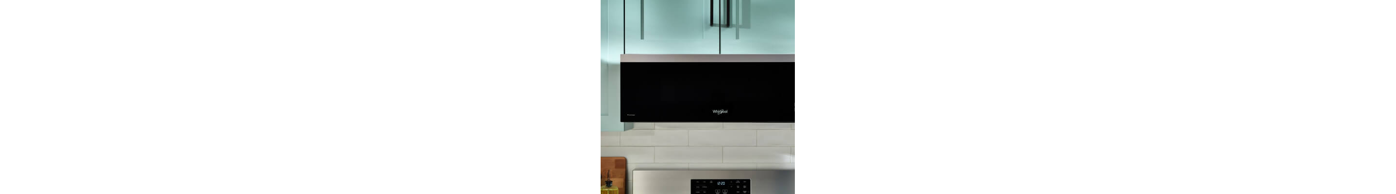 Whirlpool® Low Profile Over-the-Range Microwave in blue cabinetry