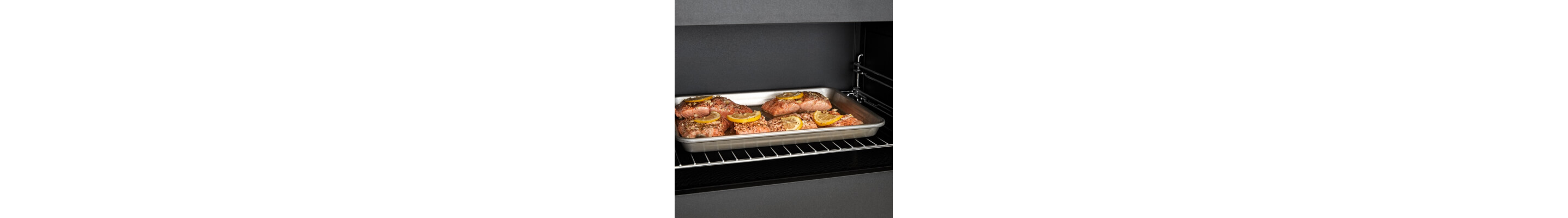 Salmon cooking on a tray inside a convection microwave