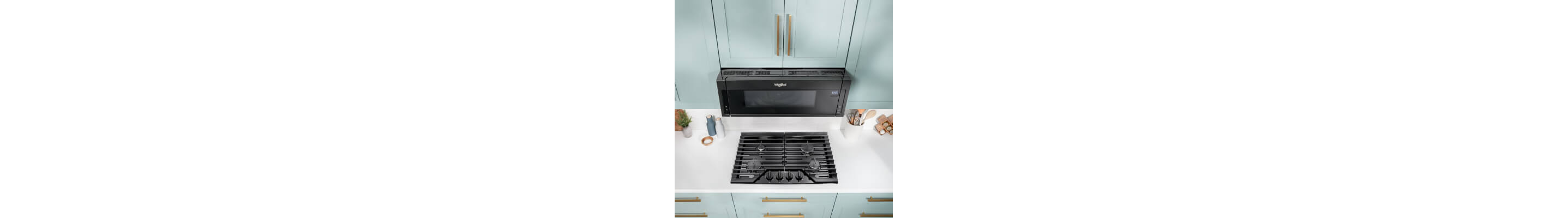 Whirlpool® Over-the-Range Microwave in light blue cabinetry