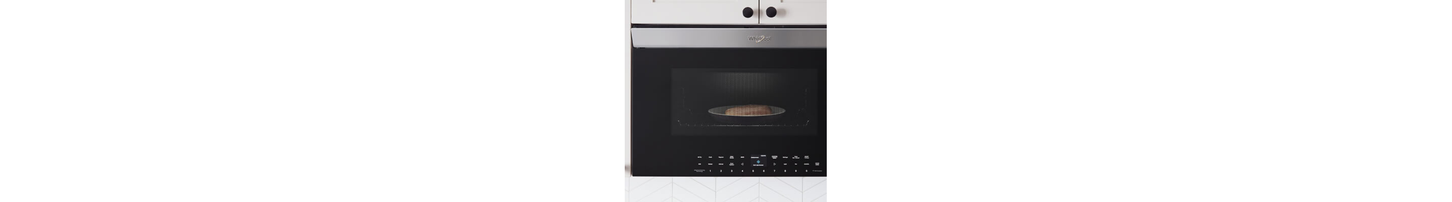 Close-up of food cooking inside an over-the-range microwave