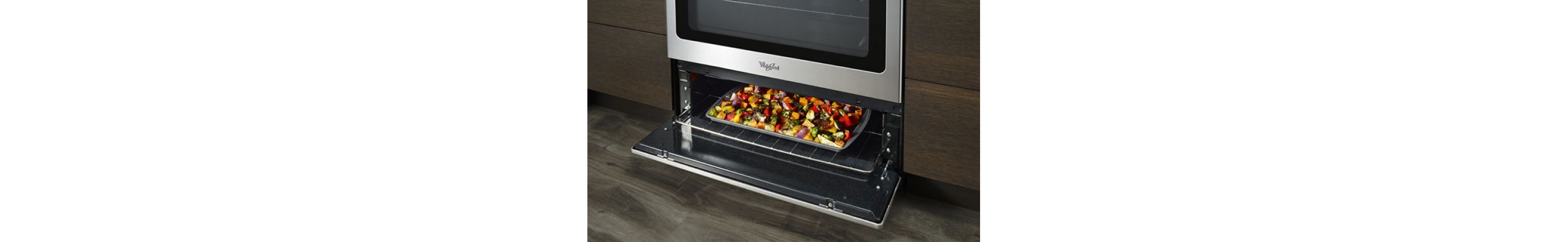 Food in an open broiler drawer