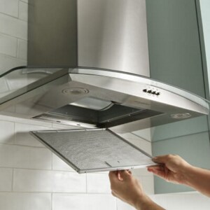 Someone taking the filter out of their range hood