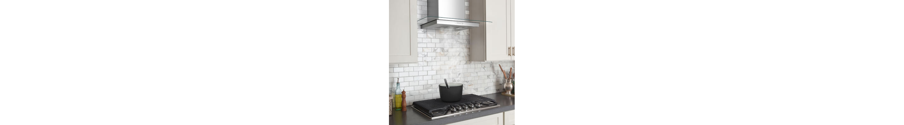 Vent hood over a gas cooktop heating a pot