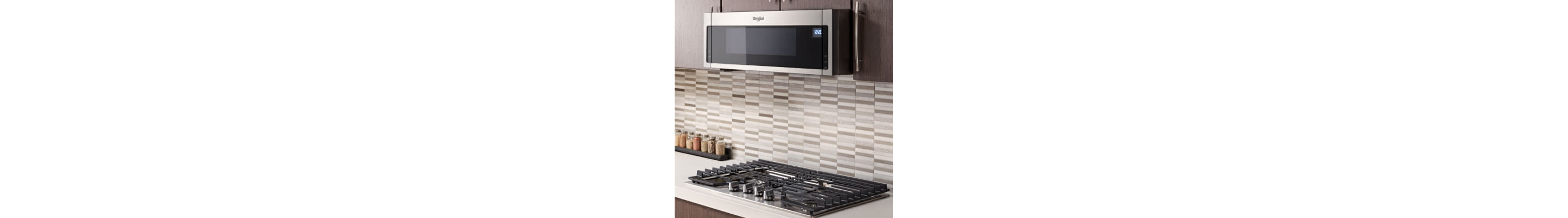 Whirlpool® low profile over-the-range microwave above a gas cooktop